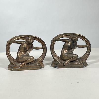 Pair Art Deco Brass Bookends | Art Deco style bookends, each showing a partially clad woman. - h. 5.25 x w. 6.5 in

