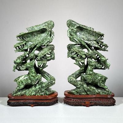 PAIR CARVED JADE FIGURAL GROUPS WITH CRANE, BAT & DEER | Jade OR serpentine - 20th century, the matched pair of Chinese carved...