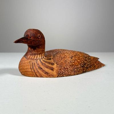 Wooden Carved Loon | Labeled, Garnet Covey Loon, 1992. Delicate carvings with glass eyes. - h. 3.5 x w. 4.5 x l. 8.5 in