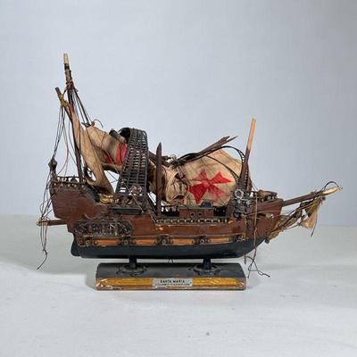 Model Colonial Ship | Carved and painted wood model of the Santa Maria with applied plastics and linen sails. - h. 12 x l. 16 in