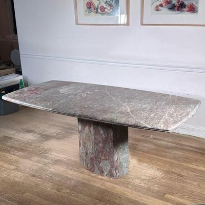 Stone Pedestal Dining Table | Designed as an angled stone top on a matching stone pedestal base. - h. 29 x w. 39 x l. 76 in

