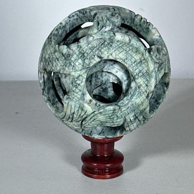 Chinese Carved Puzzle Ball | Soapstone carved reticulated puzzle bowl with wood stand, in a fitted box. - dia. 4.5 in (approx.)