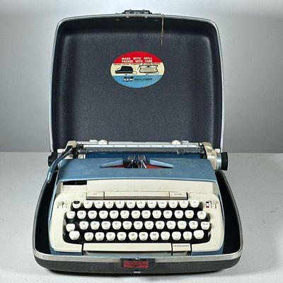 VINTAGE SMITH CORONA TYPEWRITER | Portable electric typewriter in carrying case.

