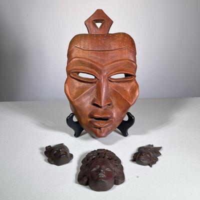 (4pc) CARVED WOOD MASKS & FACES | Large carved wood mask and 3 small decorative carved wood face. - h. 14 x w. 8.5 x d. 3 in

