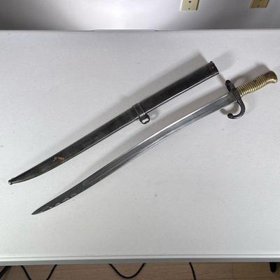 FRENCH 19th CENTURY BAYONET | Brass handled bayonet with sheath with inscription on the blade dated 1871, with "S" and...
