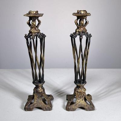 PAIR TWISTED BRASS CANDLESTICKS | Pair of twisted brass or other metal candlestick holders. - h. 12 x w. 3.5 x l. 3.5 in

