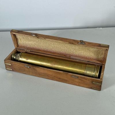 Brass Telescope | Brass monocular in a fitted wooden case with brass banding and an applied anchor emblem. - l. 13.5 x d. 3 in (box)