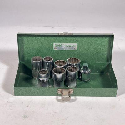(8pc) Snap on set of 7 sockets | Group of seven Snap-On twelve-point sockets in a metal S-K Tools case.

