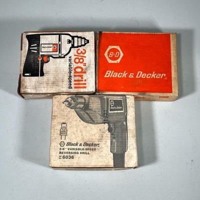 (3pc) Black & Decker Compact Drills | Including two 3/8th inch drills and a 1-1/2 inch drill. - w. 7.75 x l. 9 in (of box)

