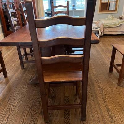 Set of 8 solid wood, ladder backed dining chairs