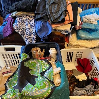 lots of clothes and linens