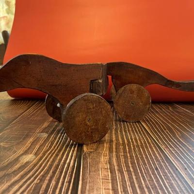 Antique wooden pull toy, otter