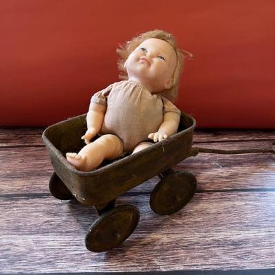 Vintage baby doll in an antique toy wagon, I found it like this and it appealed to my dark sense of humor so I photographed it just as I...