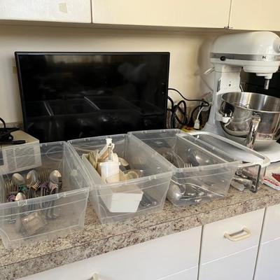 lots of kitchen stuff, nice steel pans, KitchenAid mixers, lots of dishes, small utensils, etc