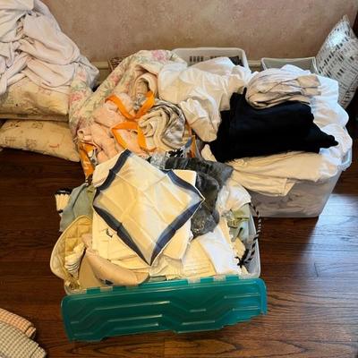 lots of clothes and linens