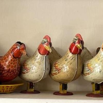 Vintage and antique tin lithographed laying hen toys by Wyandotte Toys
