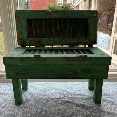 Green storage bench made of salvaged wood and antique shutters by Stuart Novy