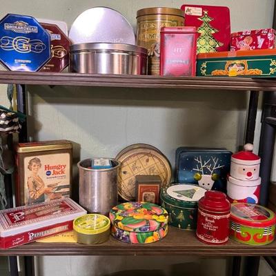 lots of advertising tins, some new, some vintage