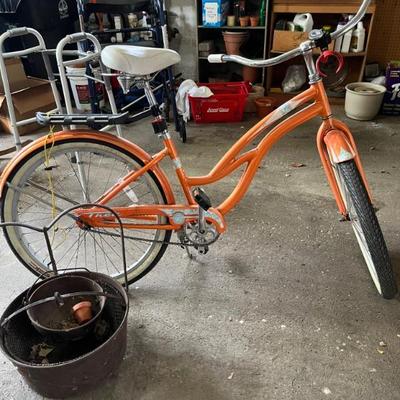a cute orange bike