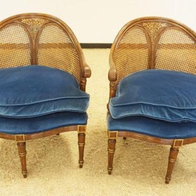 1178	PAIR OF ORNATE CANE BACK ARM CHAIRS WITH FLORAL CARVED CREST AND REEDED COLUMN LEGS, LOSS TO CANE ON ONE CHAIR, EACH APPROXIMATELY...