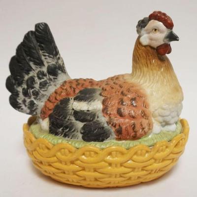 1010	ANTIQUE ROYAL RUDOLSTADT COVERED CHICKEN NESTING ON BASKET, APPROXIMATELY 11 IN X 8 IN X 8 IN HIGH
