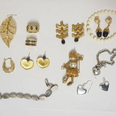 Sale Photo Thumbnail #142: 1143	ASSORTED LADIES JEWELRY INCLUDING 2 RINGS, 8 PAIRS EARRINGS, 3 BRACELETS AND ONE WIRE DOLL PIN. SOME ITEMS MARKED BY MAKER INCLUDES STERLING
