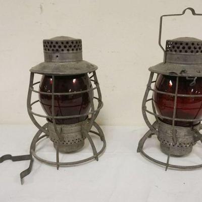 1060	2 DEITZ RAILROAD LANTERNS WITH RED GLOBES, BOTH STAMPED *CITY OF NEW YORK*, APPROXIMATELY 12 IN H, 1 WITH DETACHED HANDLE
