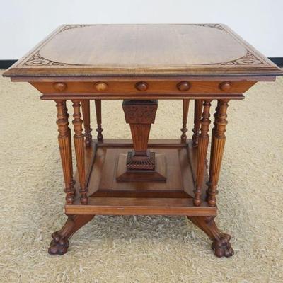 1197	ANTIQUE OAK PARLOR LAMP TABLE WITH TURNED FLUTED COLUMNS AND CLAW FEET, APPROXIMATELY 31 IN X 31 IN X 29 IN H
