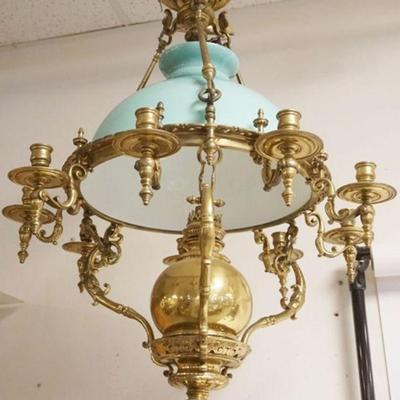 1146	ANTIQUE BRASS HANGING CHANDELIER WITH CANDLE AND KEROSENE BURNERS, GREEN CASED GLASS SHADE, APPROXIMATELY 32 IN H, BURNER ELECTRIFIED
