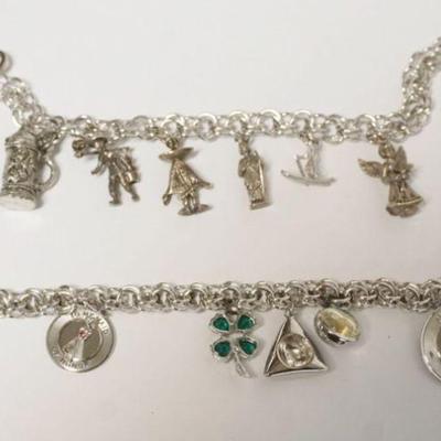 1110	2 STERLING SILVER CHARM BRACELETS, 2.73 TOZ, 12 CHARMS, 4 NO MARKINGS FOUND, BOTH APPROXIMATEY 7 IN
