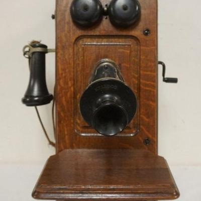 1154	ANTIQUE OAK KELLOG WALL MOUNT STICK PHONE, APPROXIMATELY 9 IN X 10 IN X 20 IN H
