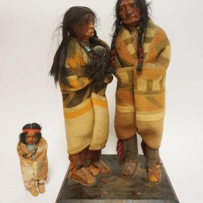 1012	AMERICAN INDIAN MAN, WOMAN, & CHILD, MAN & WOMAN MOUNTED ON WOOD BASE *SKOOKUM*, APPROXIMATELY 9 IN X 11 IN X 18 IN HIGH

