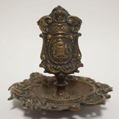 1008	VICTORIAN ORNATE CAST BRASS MATCH HOLDER ON BASE, BERNARD & FRANK NEW YORK, APPROXIMATELY 6 IN X 6 IN HIGH
