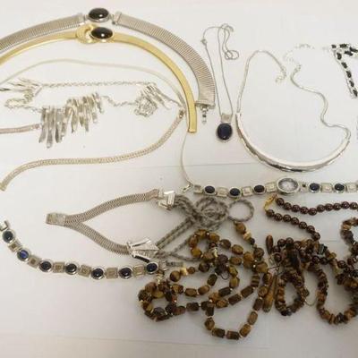 1142	10 ASSORTED LADIES NECKLACES, SOME WITH MATCHING EARRINGS, BRACELET OR WATCH. 1 STERLING
