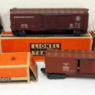 Sale Photo Thumbnail #68: 1068	LIONEL TRAINS #3484 OPERATING BOX CAR, #6454  2 BOX CARS, #6415 TANK CAR
