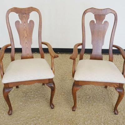 1184	PAIR OF S. BENT BROS QUEEN ANN STYLE OAK ARM CHAIRS, EACH APPROXIMATELY 25 IN X 21 IN X 42 IN H

