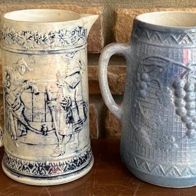 (2) 9.25" Stoneware Pitchers - Antique German And North Star Grape Motif 