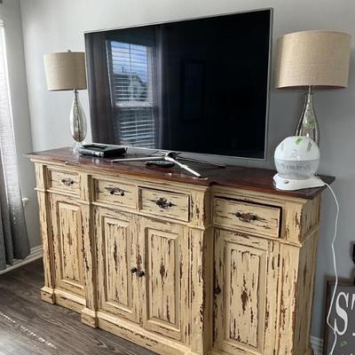 Distressed entertainment unit, TV, lamps