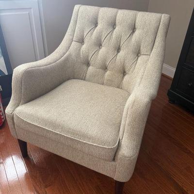 Button tufted, upholstered accent chair