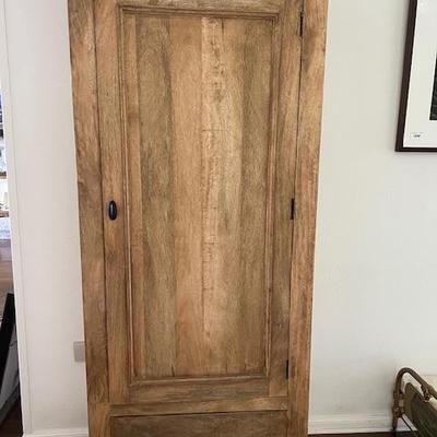 Tall wood cabinet with drawer