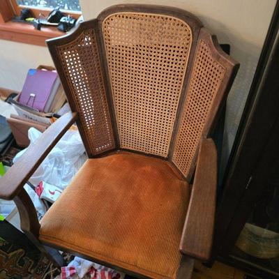 Antique cushioned 3 panel caned chair