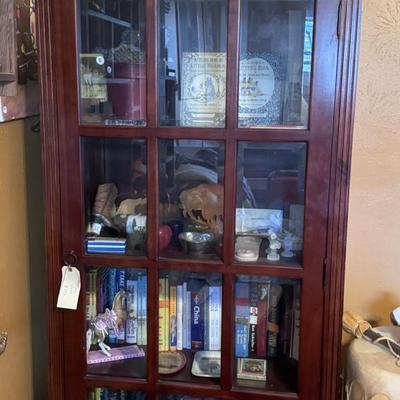 Cabinet, books, tiles, trinkets, and collectibles