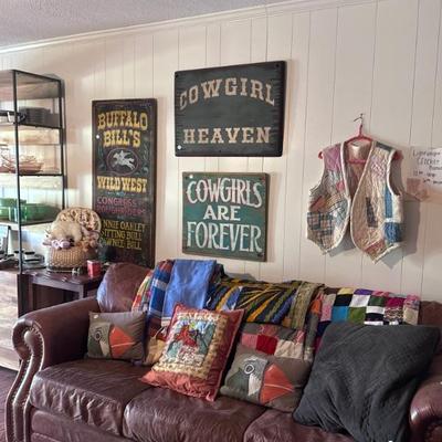 Leather sofa, quilts, wood wall signs
