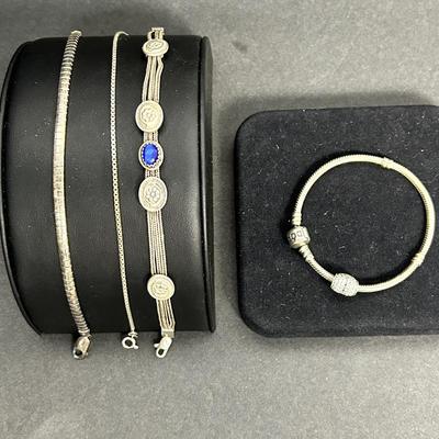Sterling Silver Bracelets, including a Pandora Bracelet with a Heart Charm 