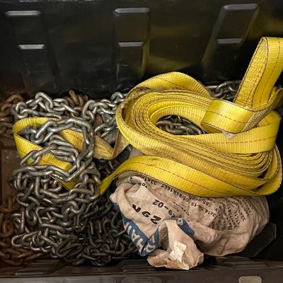 Bin Of Tire Chains And A Tow Strap 