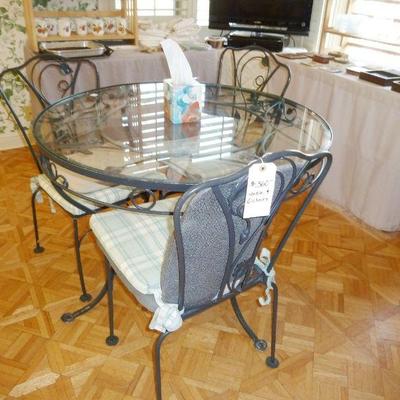 $240 - Cast Metal Table (glass top) with 6 Chairs (was $360)