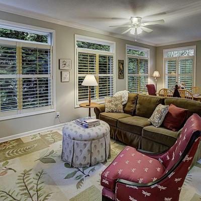 Second couch, wool rug, dragonfly chair and ottoman/coffee table