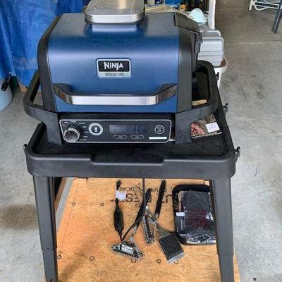Ninja wood burning grill with stand.  Very clean.