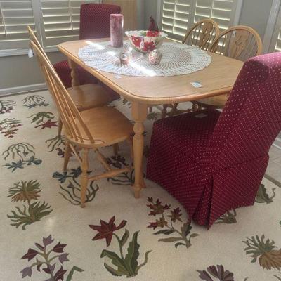 Kitchen table has leaf, 4 chairs and two parsons chairs