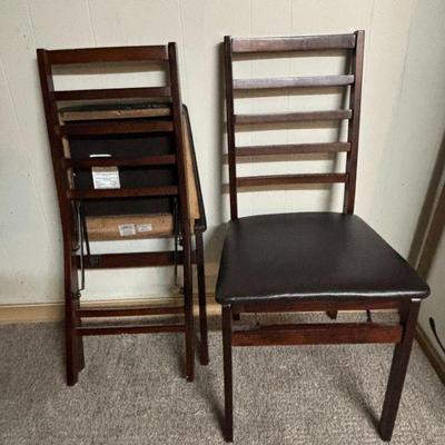 Lot #109 - Set of 2 Folding Chairs - Dark Wood with Black Upholstered Seats.